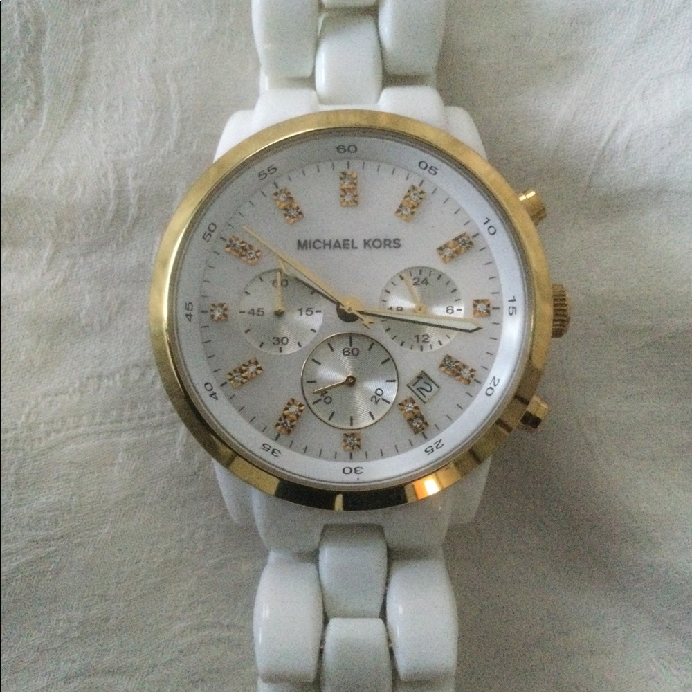 EUC Michael Kors white resin watch with gold detail.